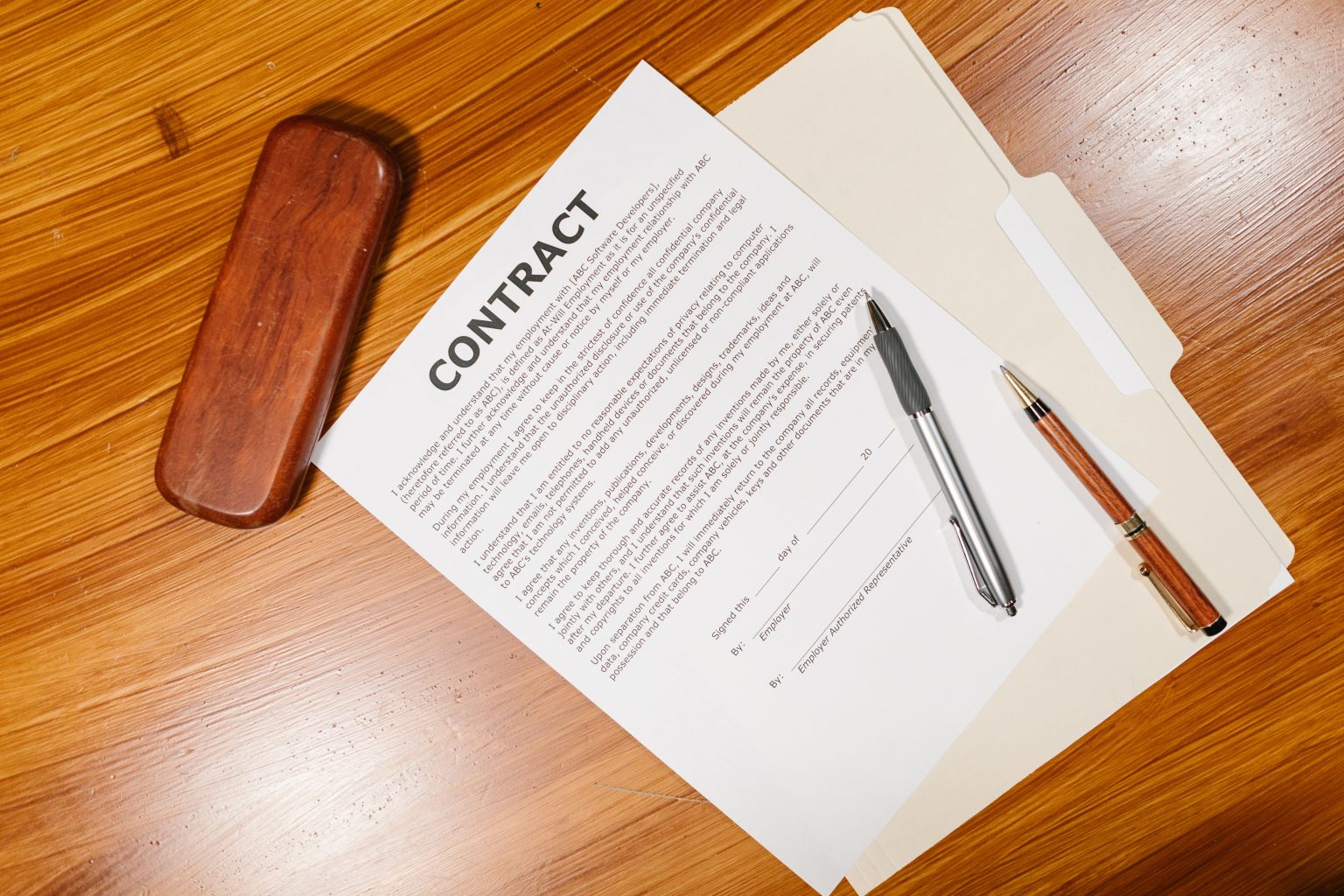 Aircraft purchase contract and pens on a desk